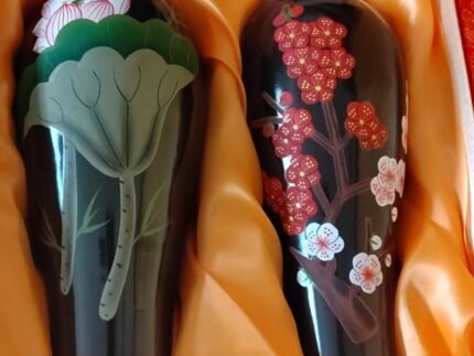 Black pottery floral vase set with lotus and plum blossom motifs in a gift box