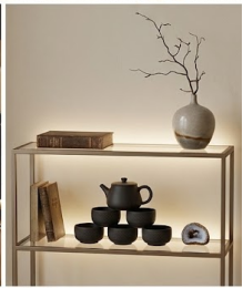 Handmade Black Pottery Tea Set Displayed with Decorative Vase