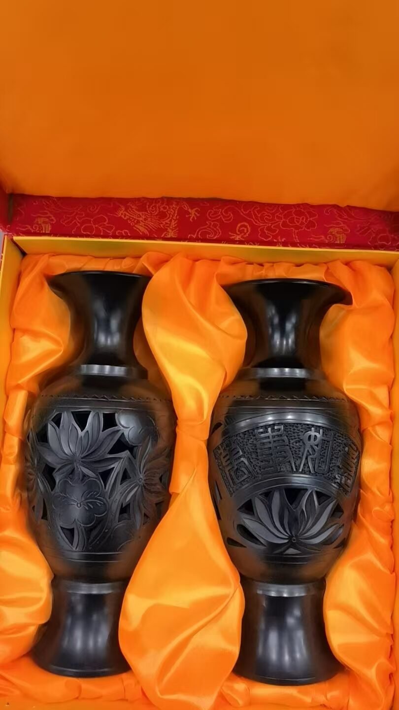 Black pottery vase set displayed in a modern interior with elegant oriental home decor style